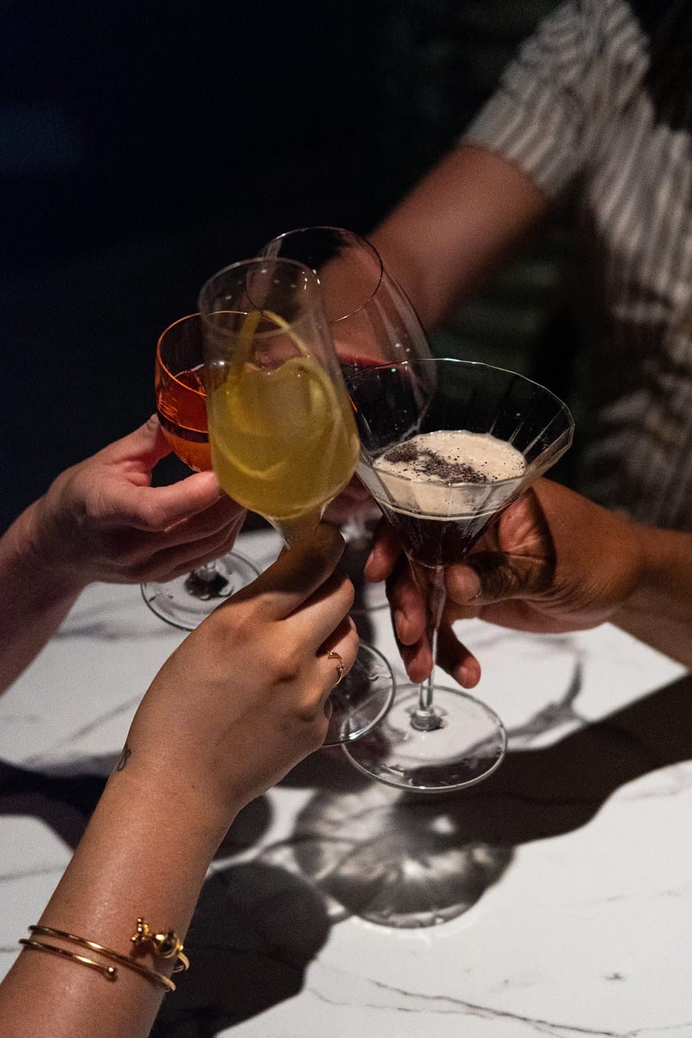Guests toasting cocktails at a celebration at Georgie's Social House